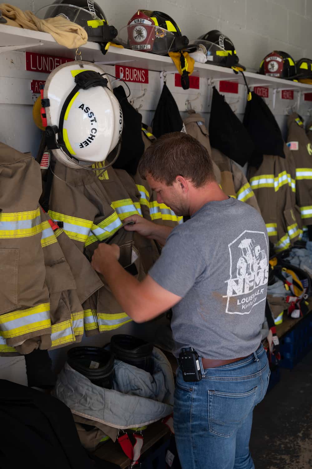 Volunteer firefighter checking his gear.